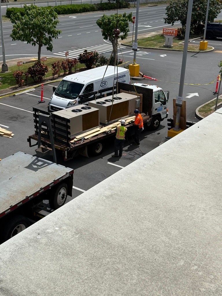 Row of outdoor HVAC air conditioning units and pipes on a rooftop against a bright sky Row of outdoor HVAC air conditioning units and pipes on a rooftop against a bright sky