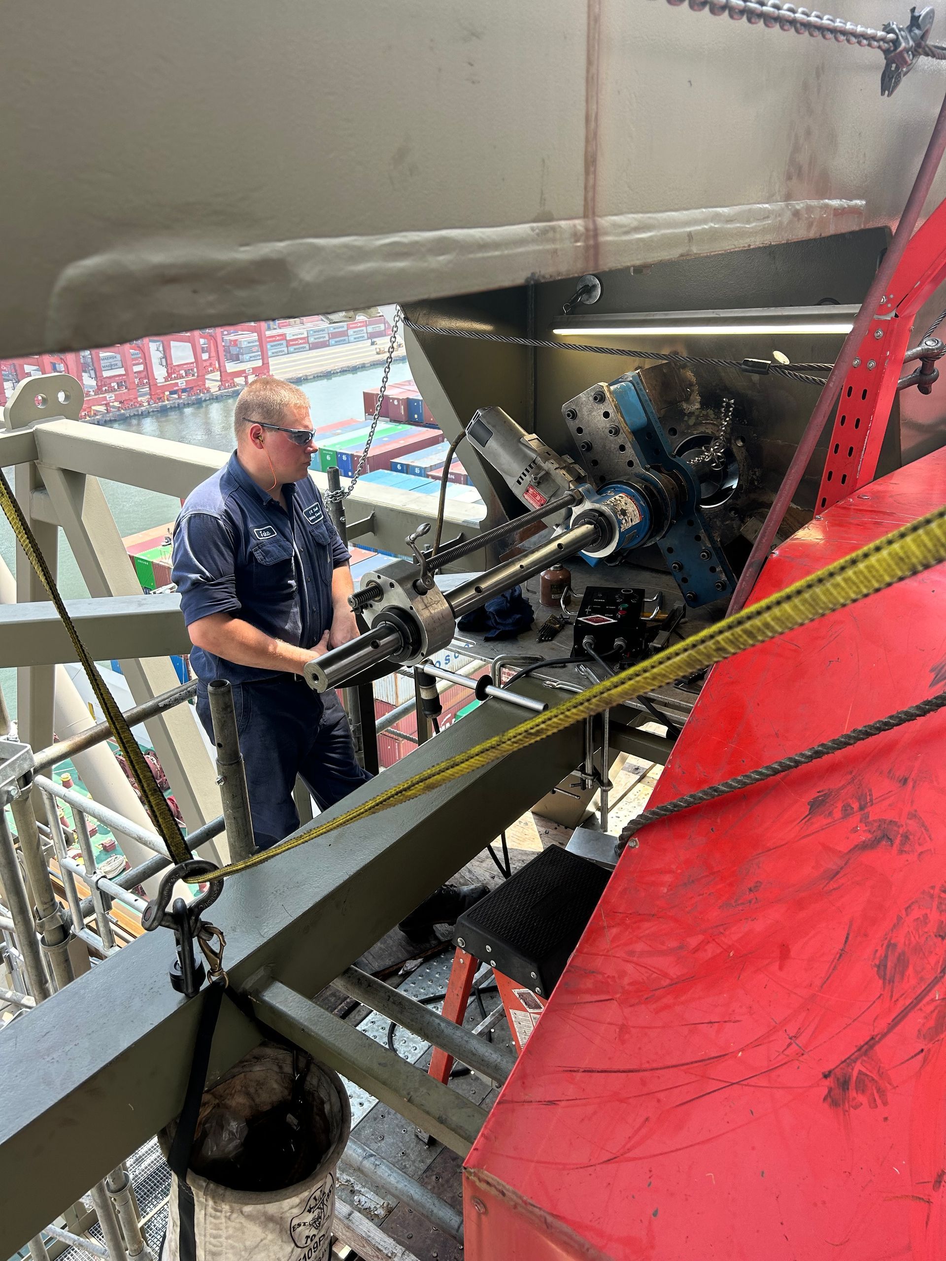 Worker inspecting Port Equipment