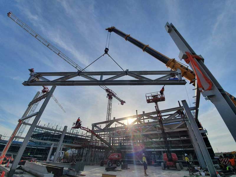 Building Structural Steel with Crane — Ulladulla Crane Hire in Milton, NSW