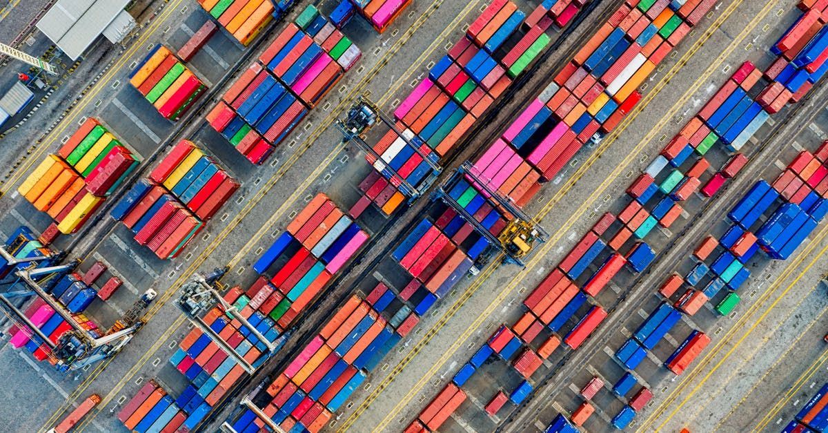 An aerial view of a warehouse filled with lots of colorful shipping containers.