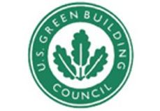 Logo du US Green Building Council : un cercle vert avec du texte et trois feuilles de chêne vertes.