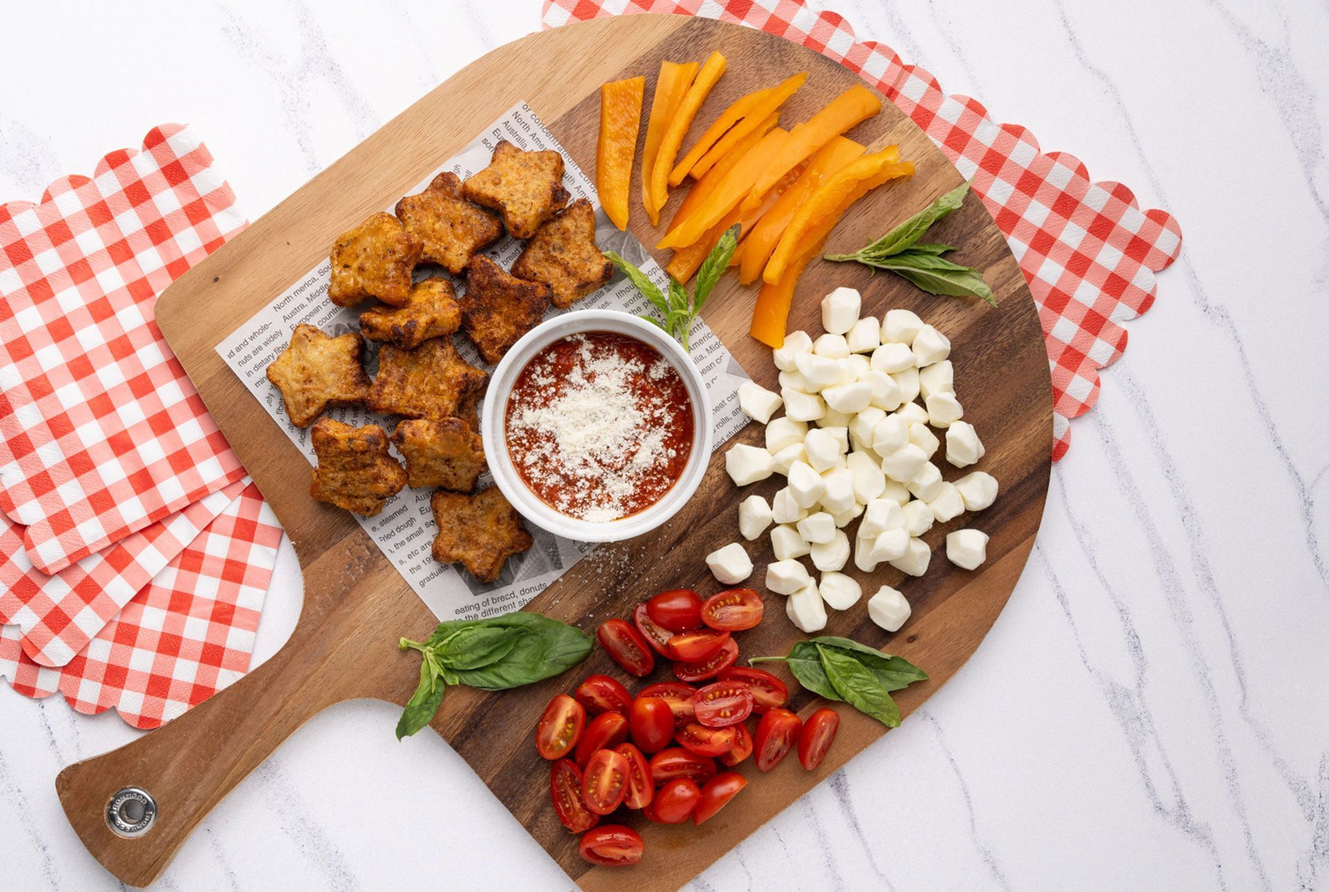 Pizza snack board with marinara dip made with Dr. Praeger's Pizza Stars