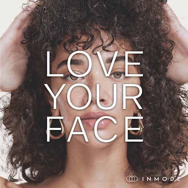 A picture of a woman with curly hair and the words love your face