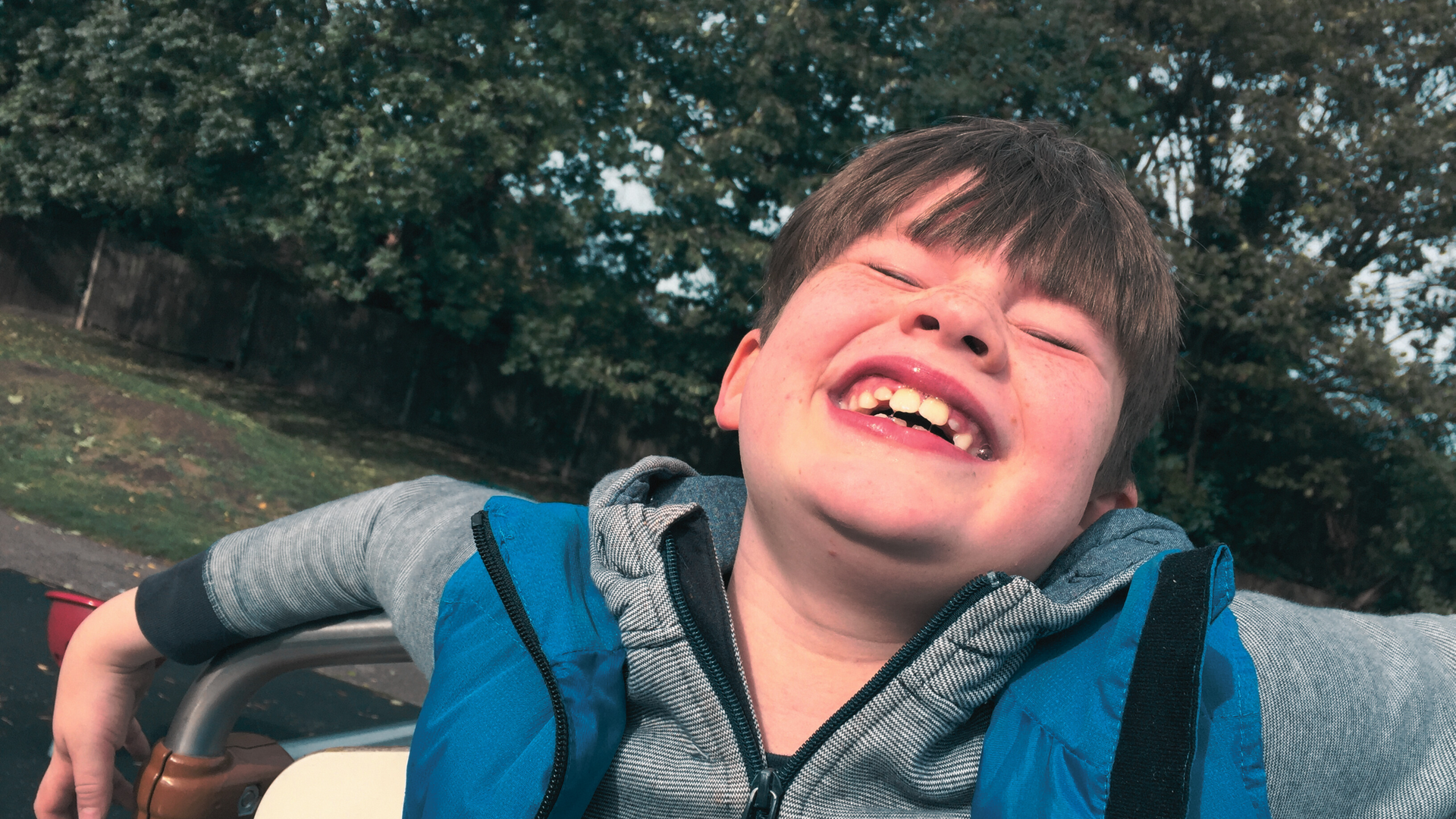 Portrait of a smiling young resident at Hope House, a sanctuary for children with special needs in Texas