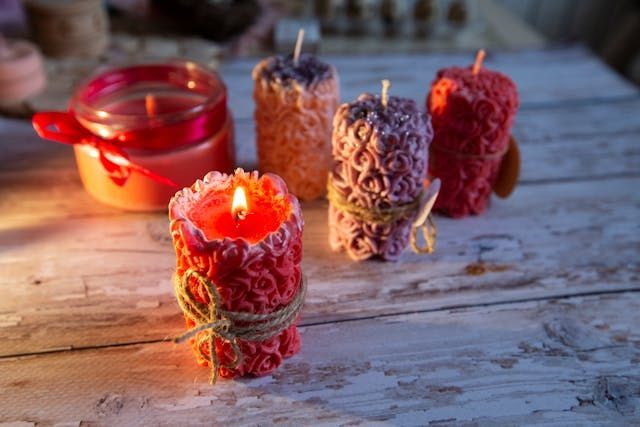 Candles glowing on a rustic table create a comforting scene for cremation services New Orleans, LA