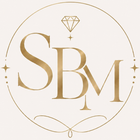 Gouden SBM-logo met een diamantvormig icoon in een dunne cirkelvormige omlijsting op een witte achtergrond.