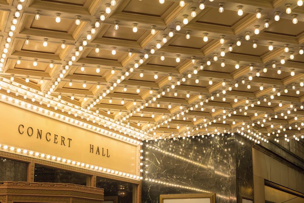 The Ceiling of a Concert Hall is Lit Up With Lots of Lights — Bangalow Electrical in Bangalow, NSW
