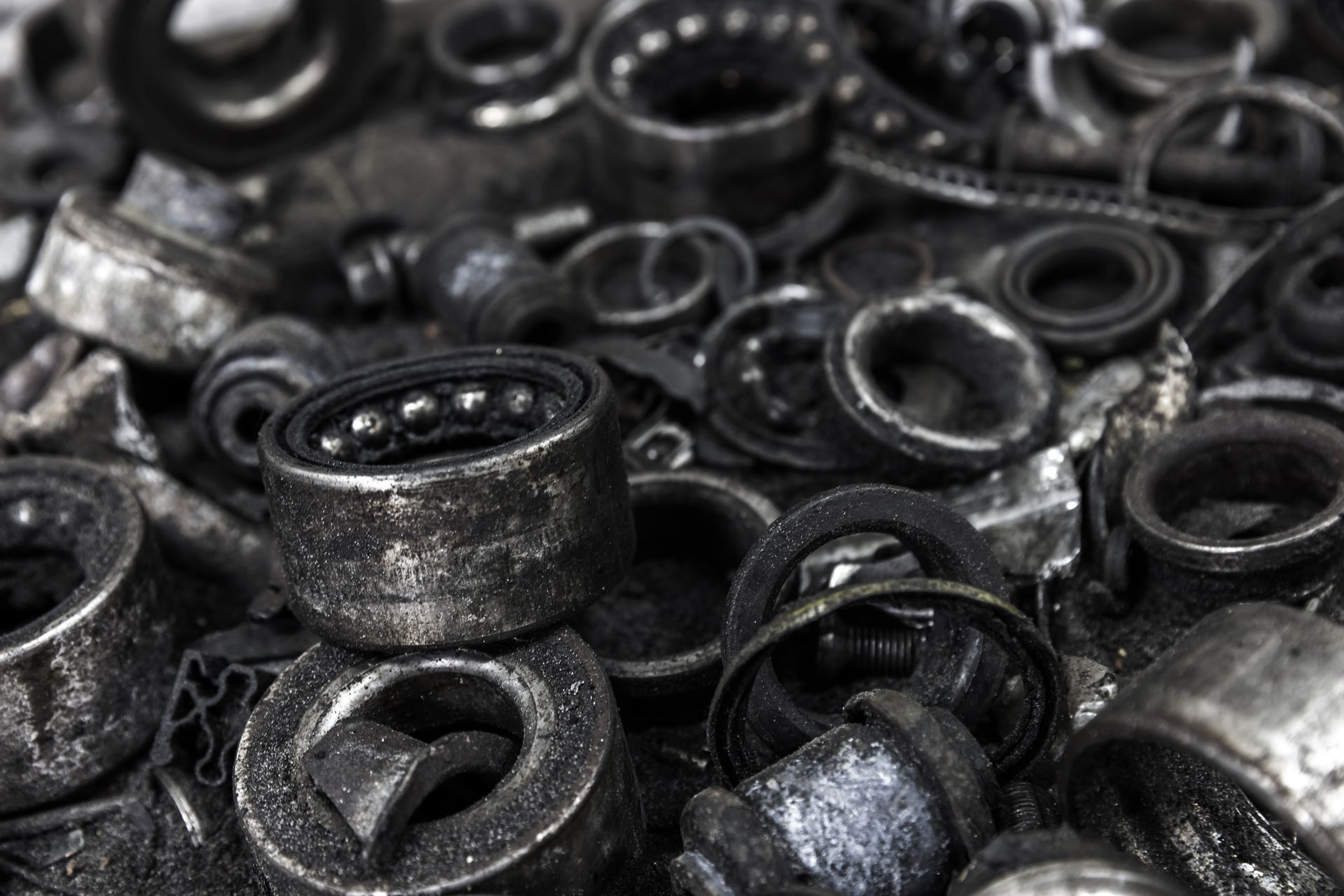 Used automotive bearings and components showcasing equipment maintenance requirements.