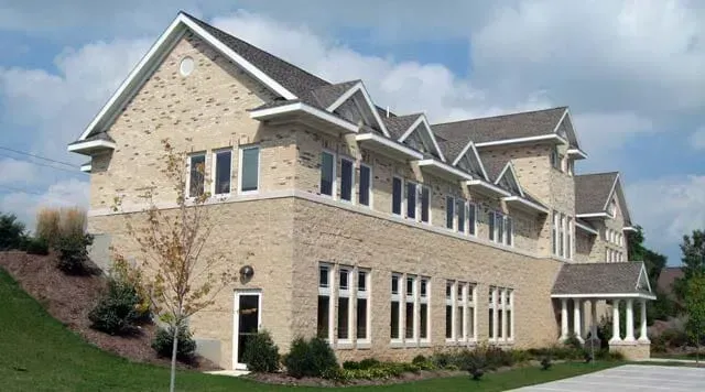 A Large Brick Building with A Lot of Windows | Sheboygan, WI | Elite Builds