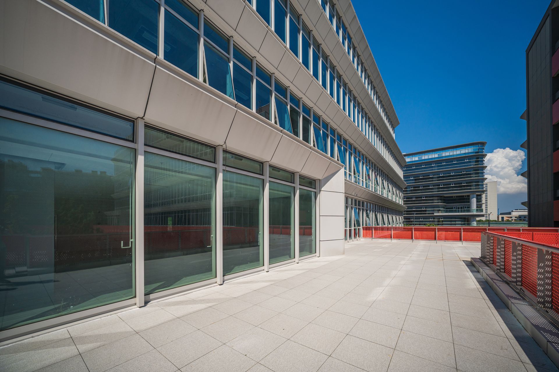 Glass curtain wall of office building.