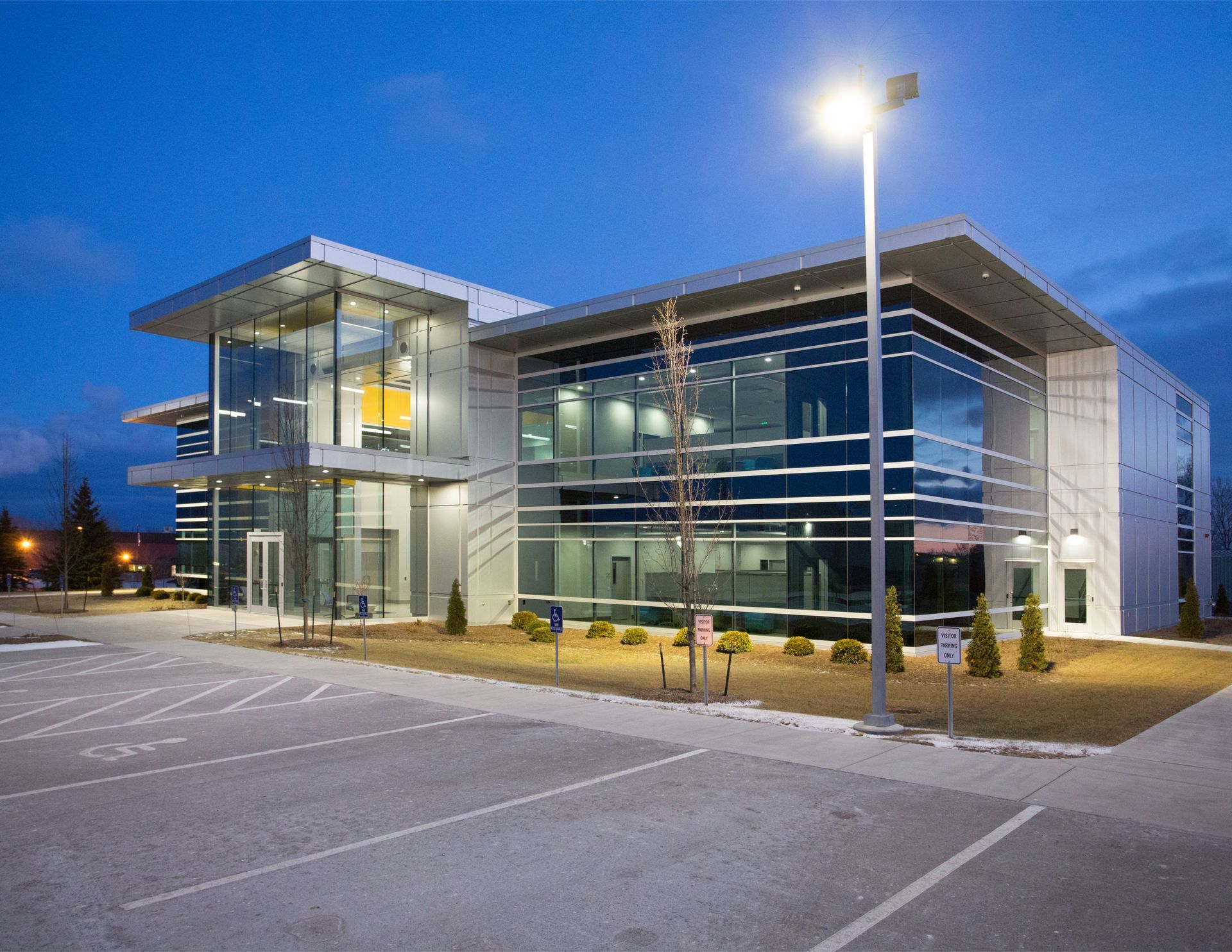 A Large Building Under Construction with A Sign in Front of It | Sheboygan, WI | Elite Builds