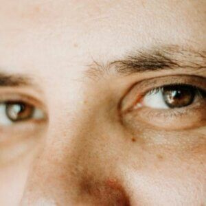 A close up of a man 's eyes and nose.