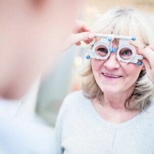 A woman is getting her eyes checked by an ophthalmologist.