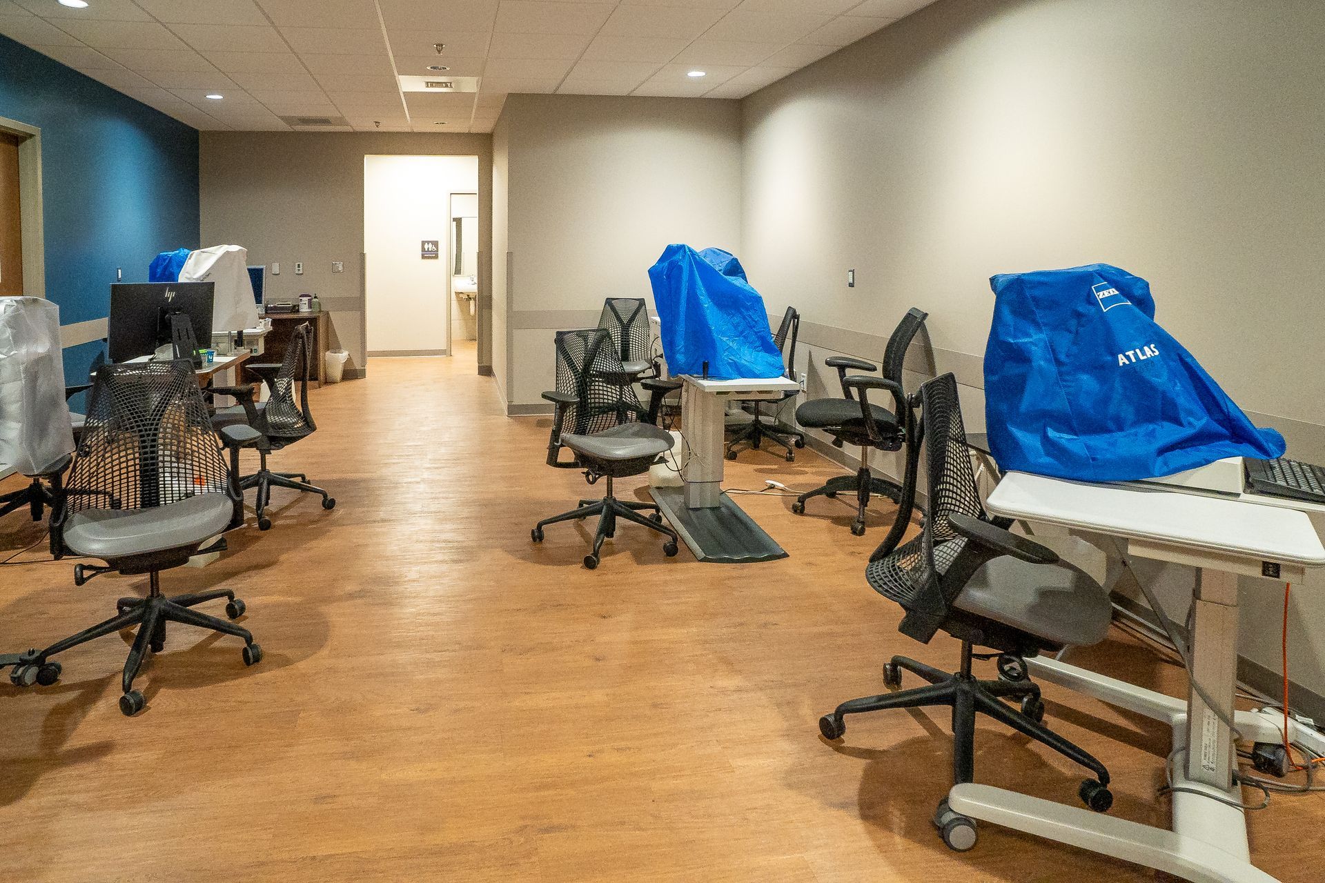 A room with a lot of chairs and tables in it.