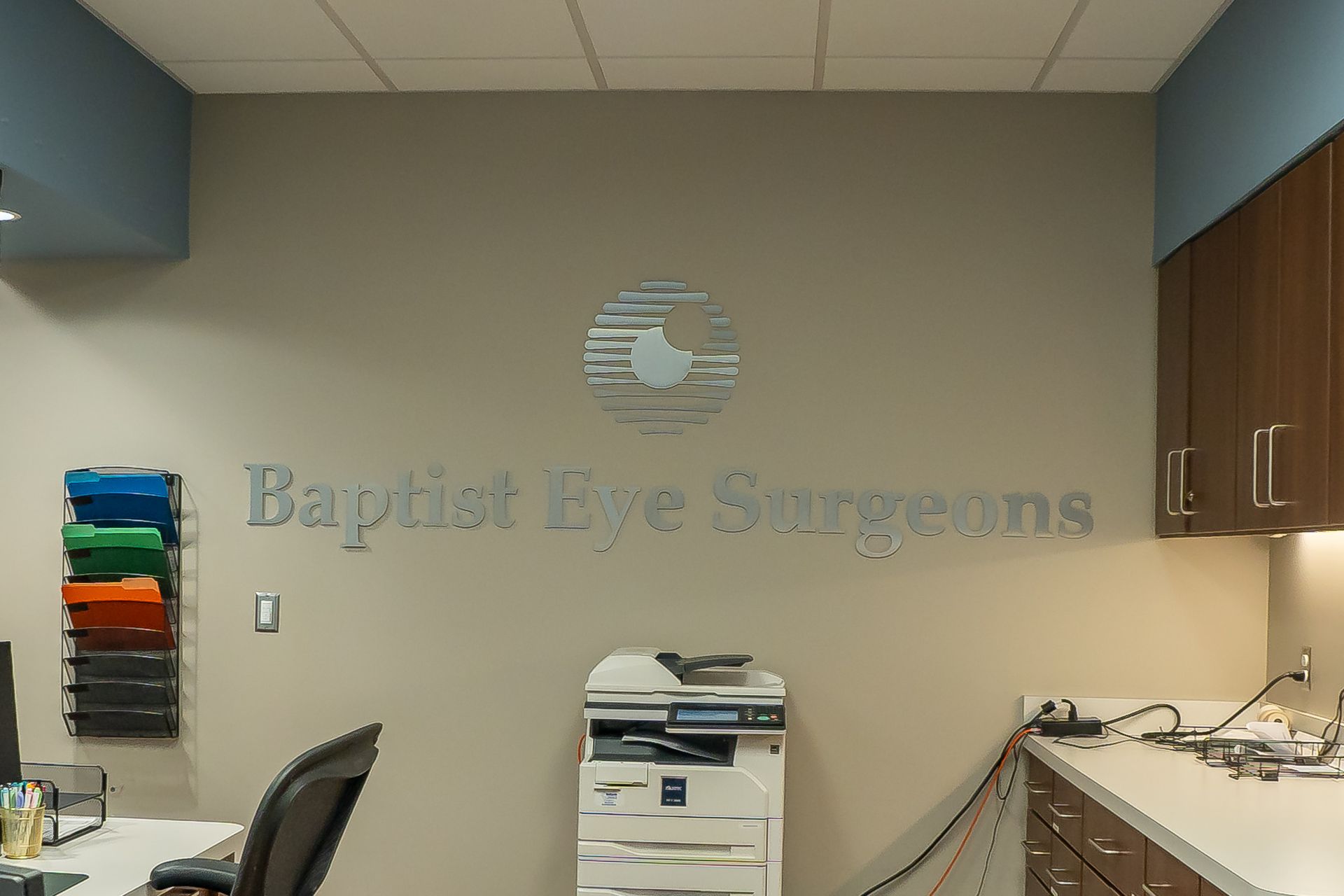 A room with a sign that says baptist eye surgeons
