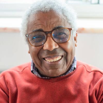 smiling mature man smiling at home