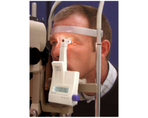 A man is getting his eyes examined by an ophthalmologist