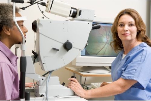 A man is getting his eyes examined by an ophthalmologist