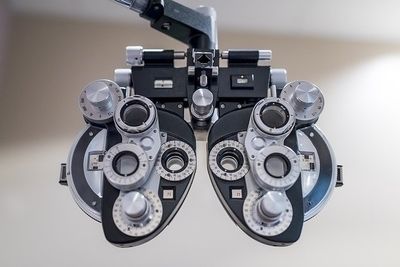 A pair of eye testing glasses hanging from the ceiling.