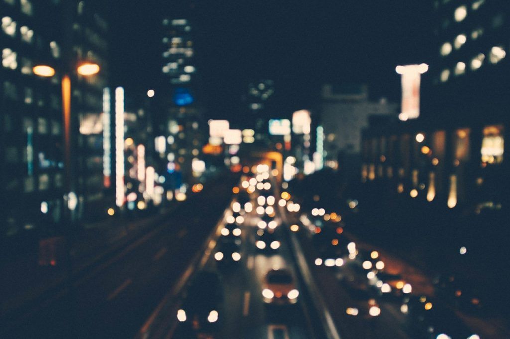 A blurry picture of a city street at night.