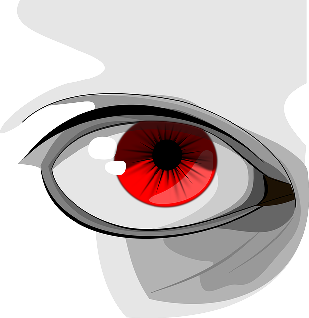 A close up of a person 's eye with a red pupil