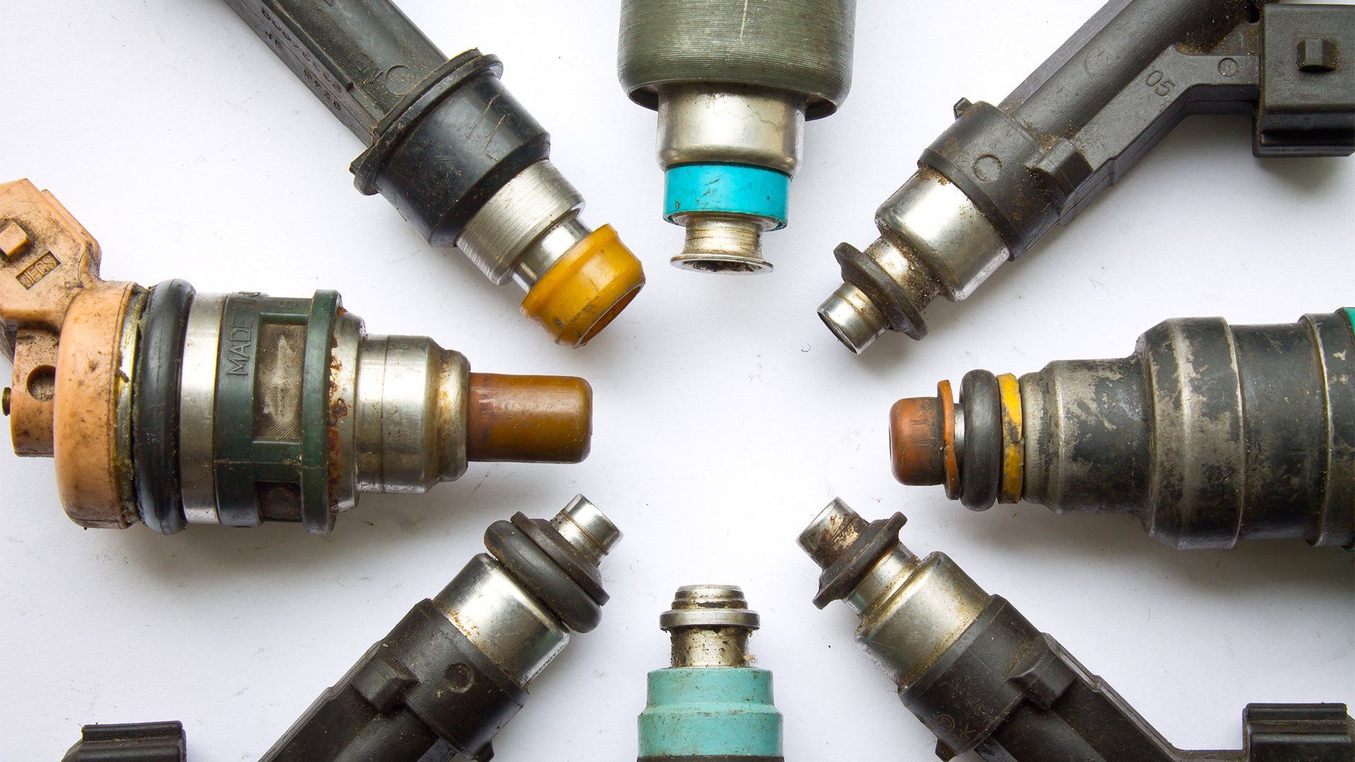 old and used diesel injectors forming a circle