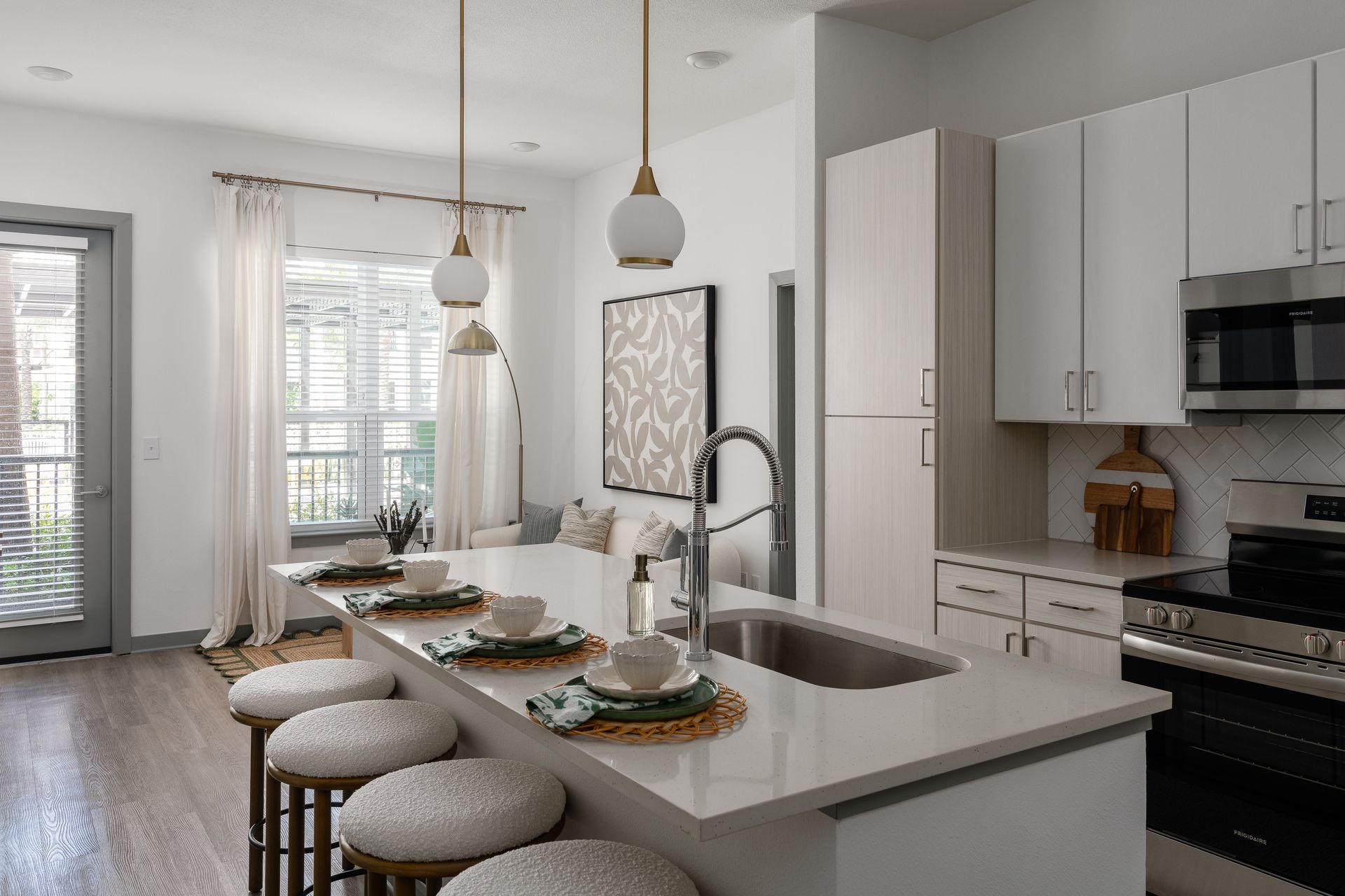 A man and a woman are holding a dog in their arms