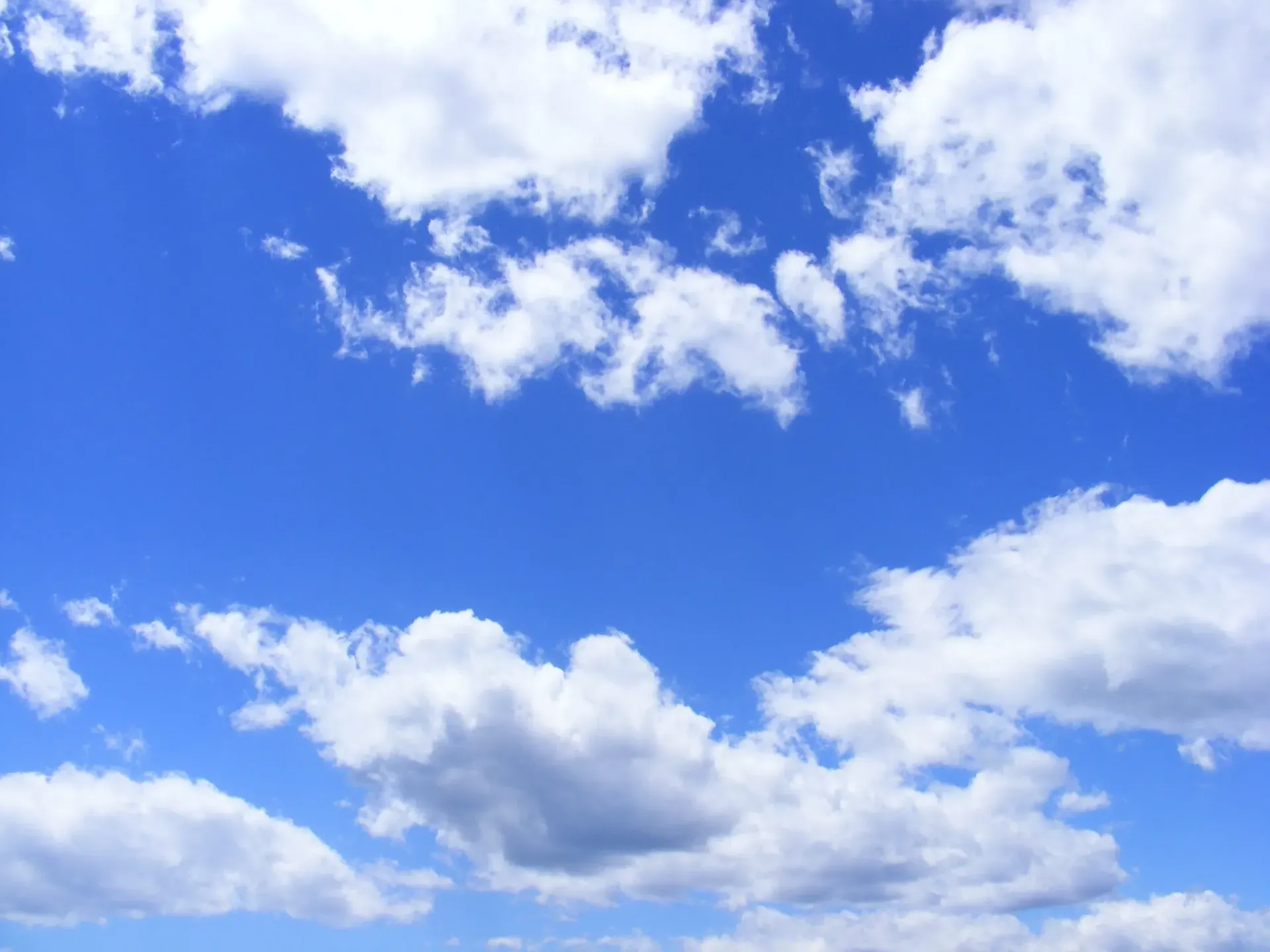Blue sky with scattered white clouds