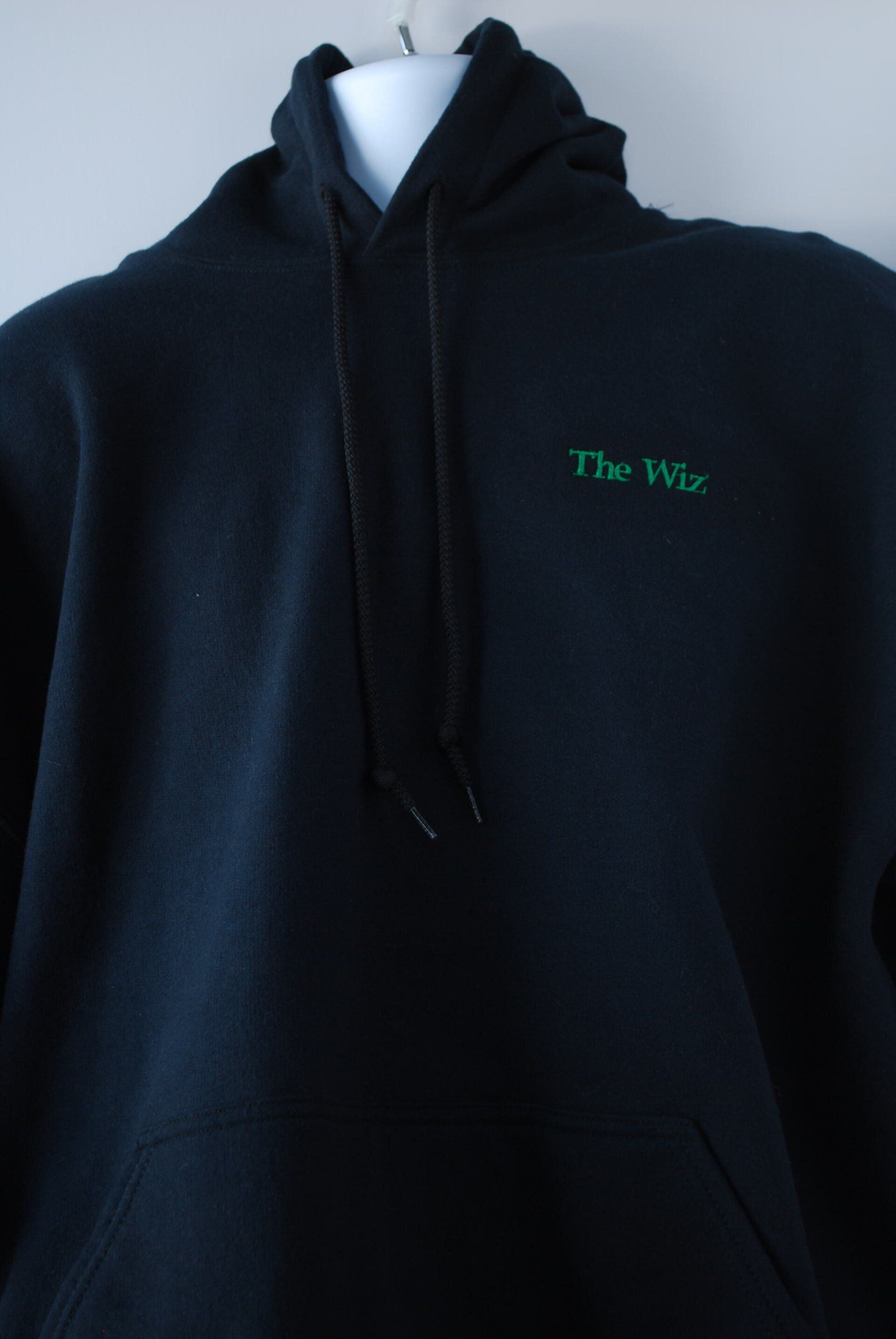 A dark colored hoodie with heat press artwork