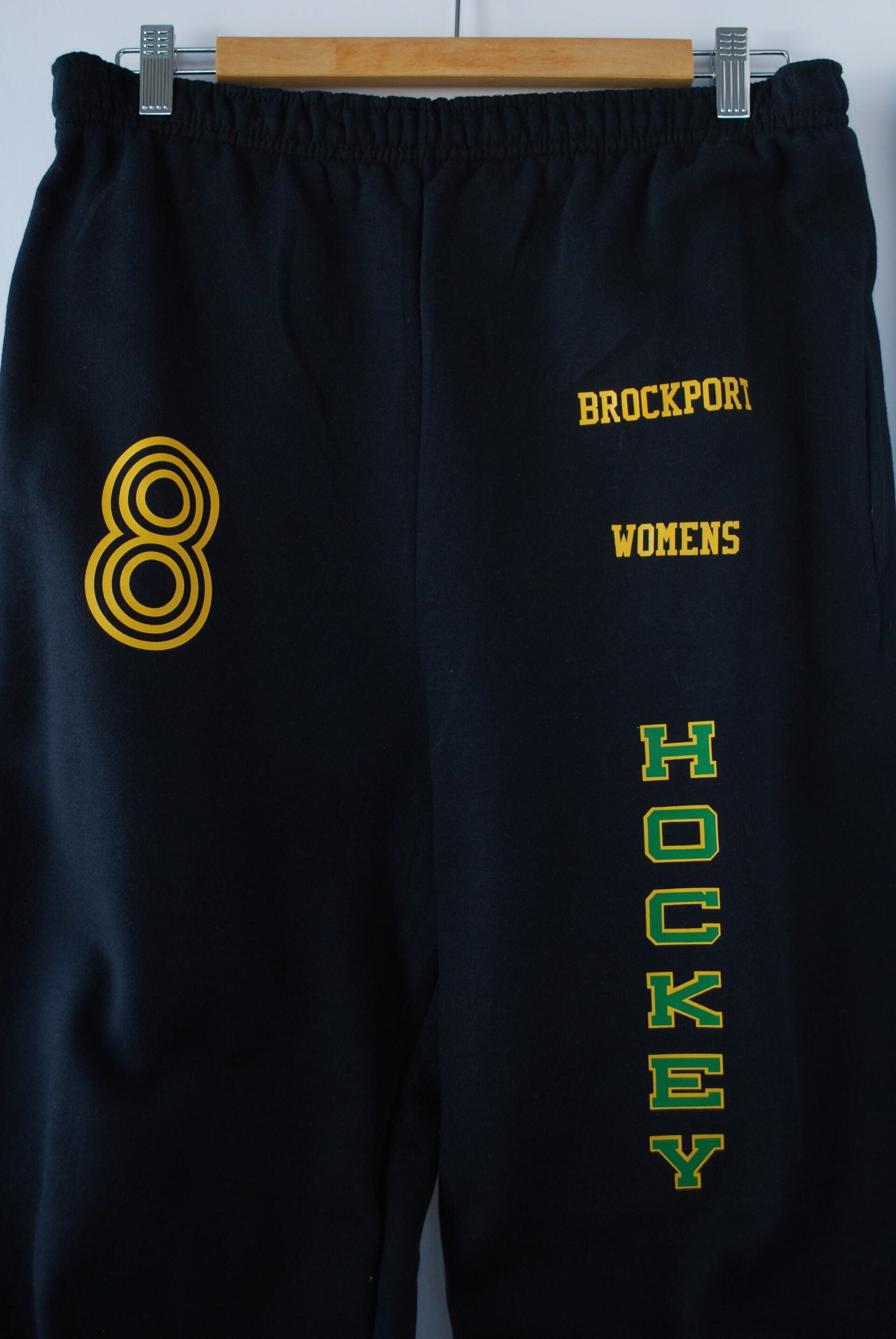 A pair of black sweatpants with heat press artwork