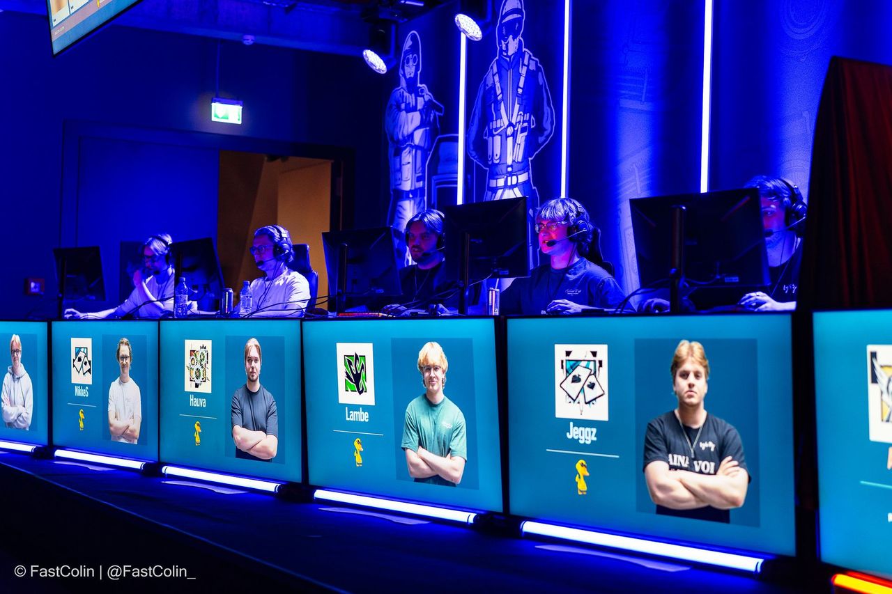 Stage with players and team screens