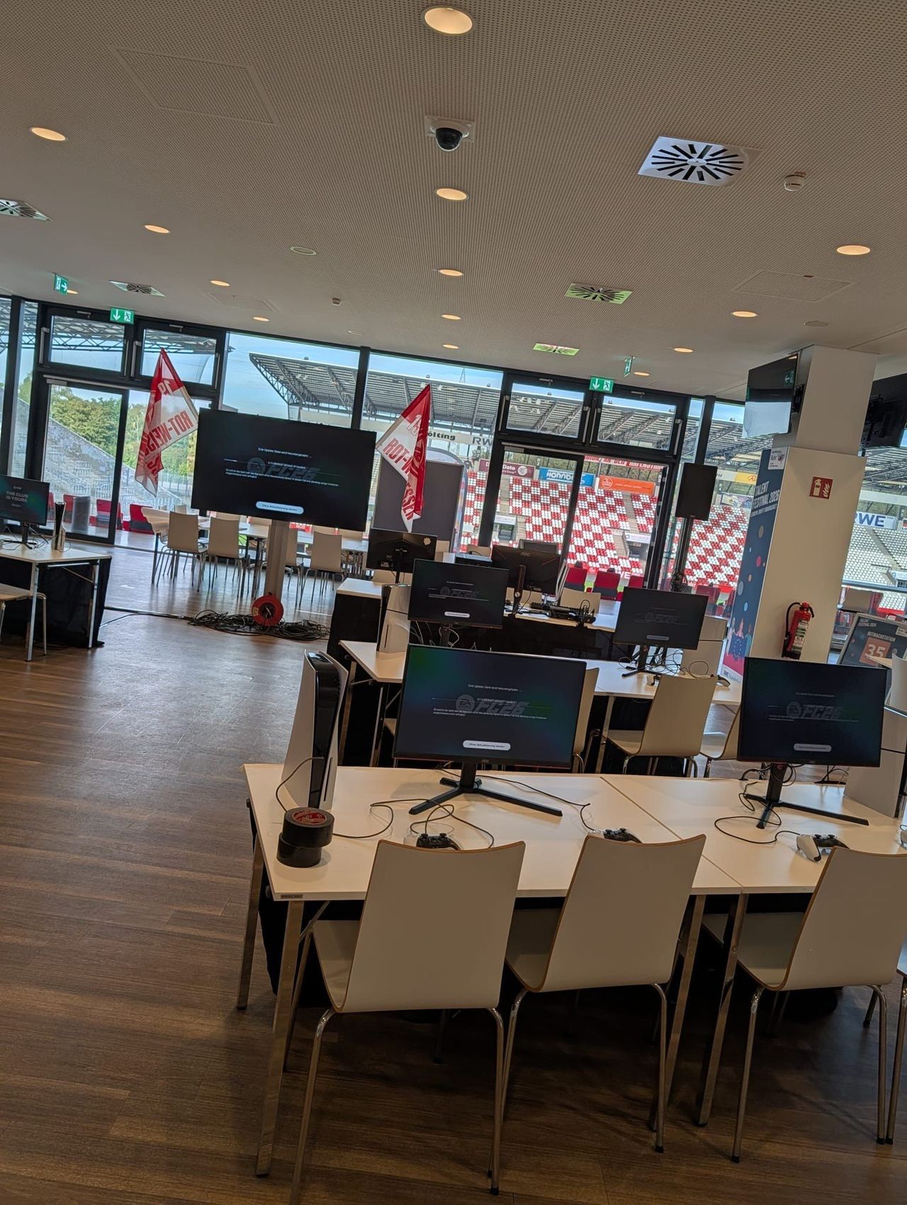 EA FC stations with monitors and controllers during setup