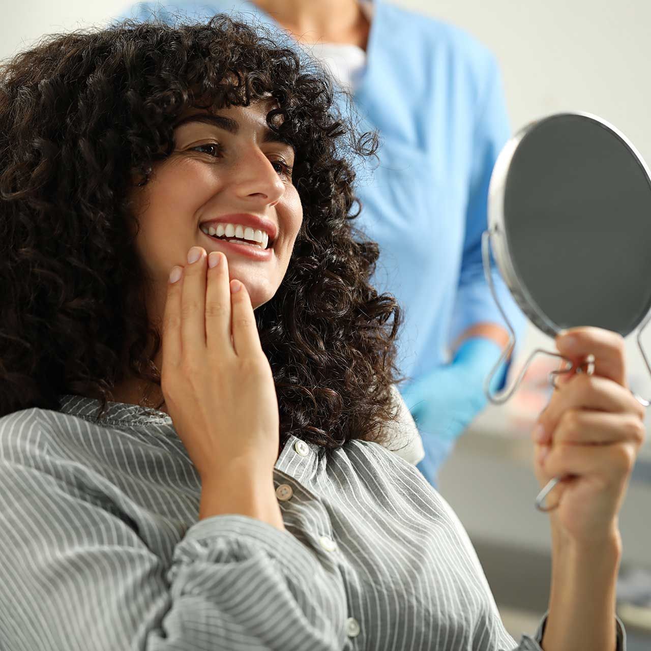 Patient looking in mirror and doctor in clinic, selective focus.
