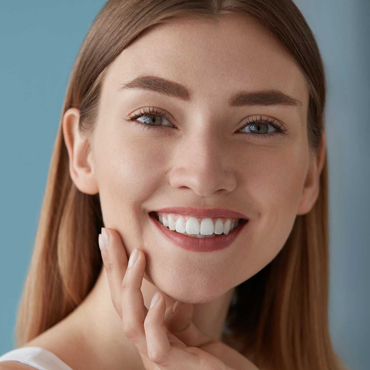 Beauty portrait of smiling woman with white teeth smile