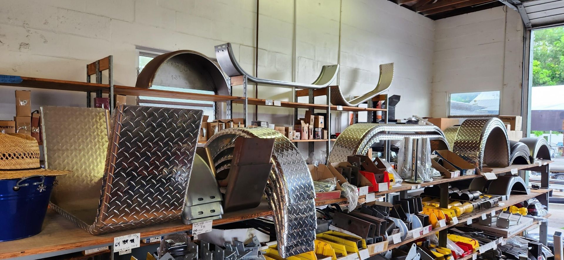 Industrial workshop with large metal machinery parts and tools arranged on a workbench