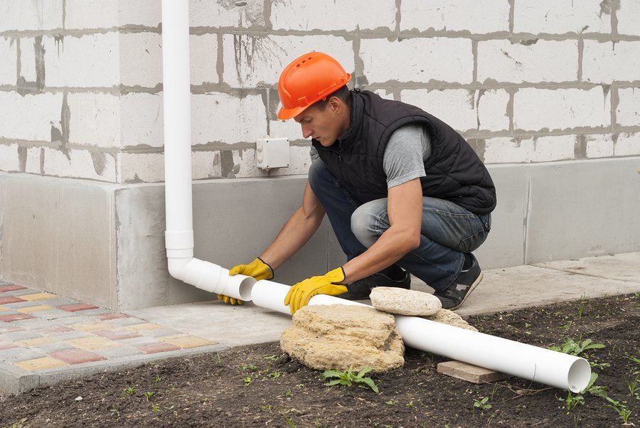 worker installing the water pipe