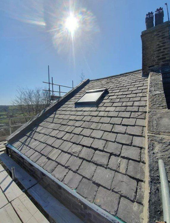 Picture of a new slate roof installed by Roofers Leeds