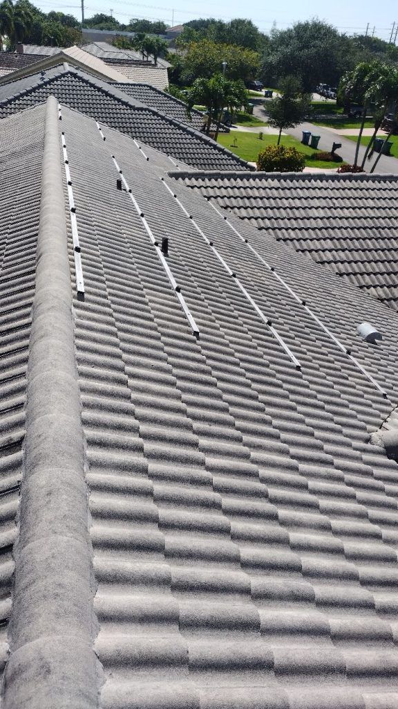 The roof of a house with a lot of tiles on it.