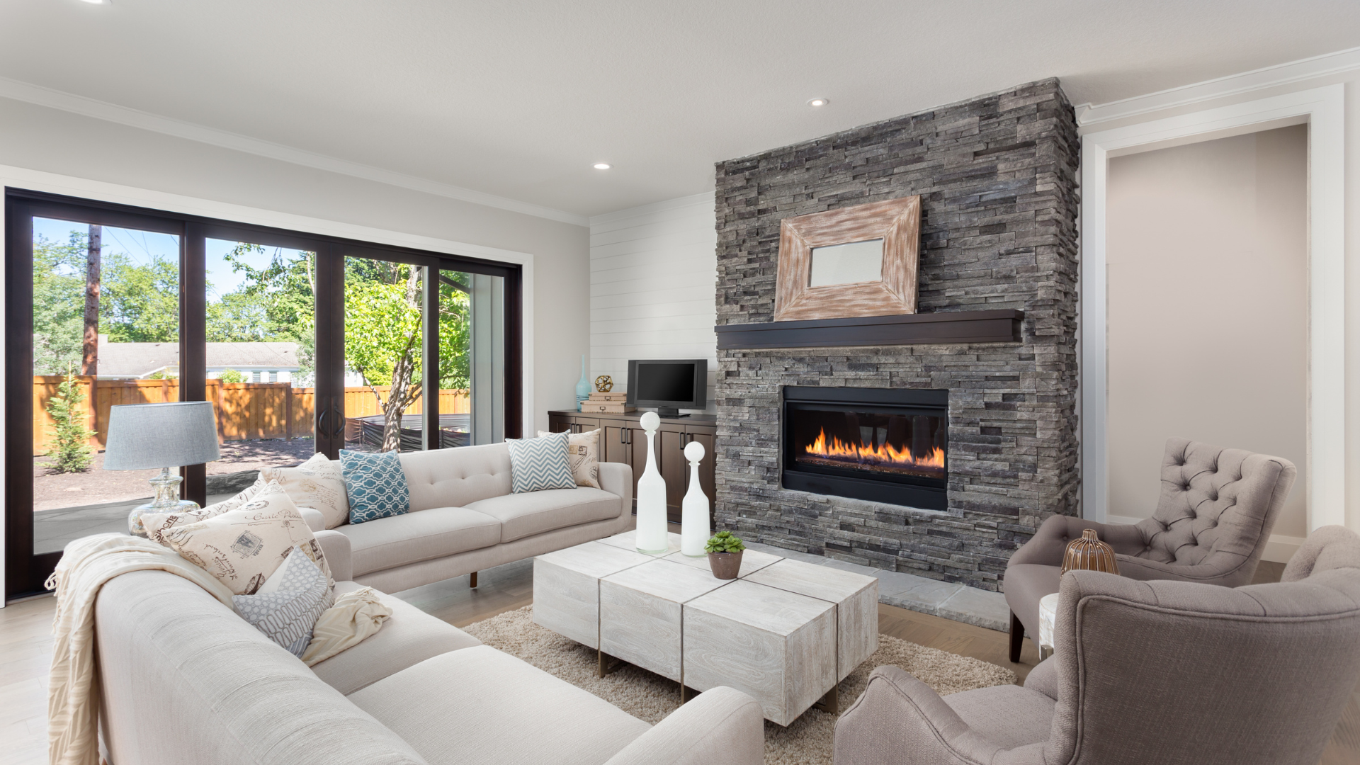 A living room filled with furniture and a fireplace.