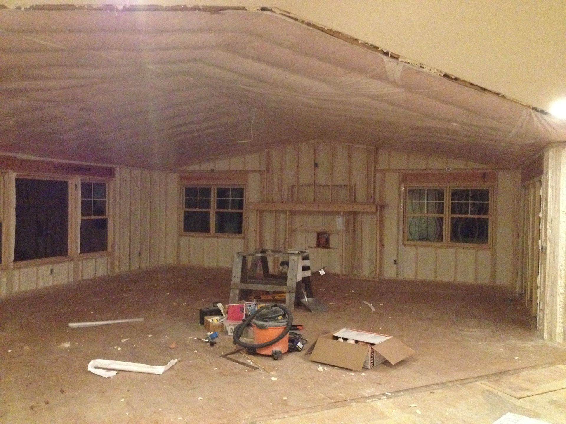 An empty room with a vacuum cleaner on the floor