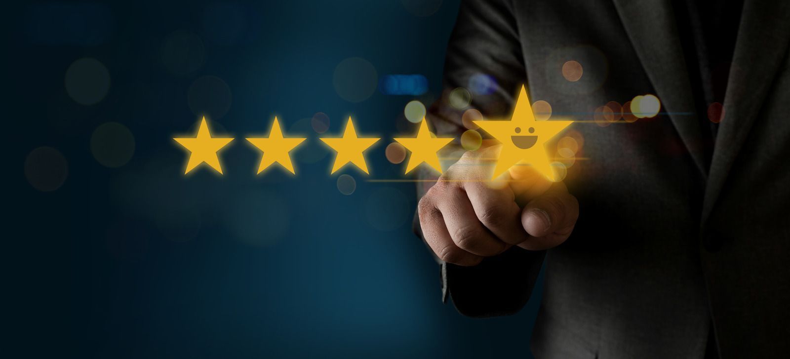 Hand pressing glowing five-star rating icons on a dark blue background