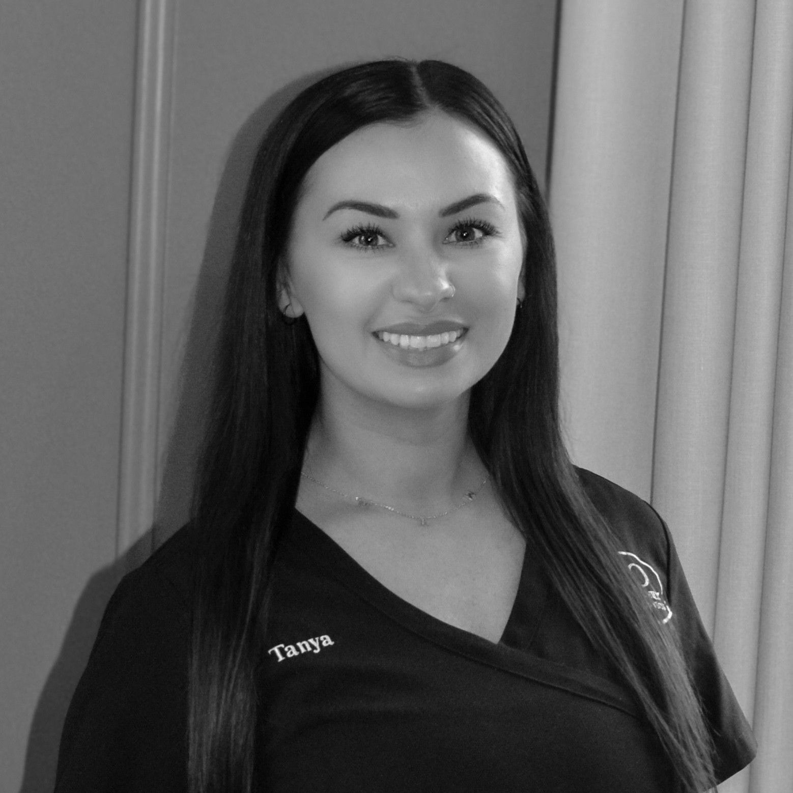 Tanya is an orthodontic assistant and smiling for the camera