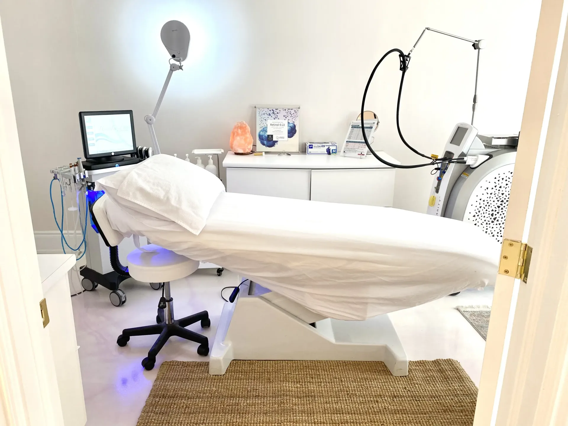 There is a bed in the middle of a room with a lot of equipment.