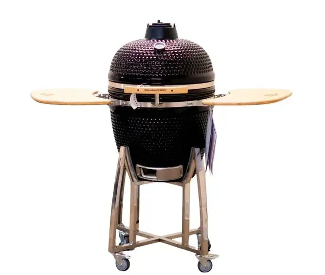 Black ceramic grill with wooden side shelves on a wheeled stand