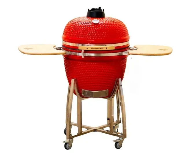 Red ceramic grill on a wooden stand with side shelves and wheels