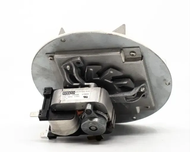 Open round metal device with exposed black motor and wiring on a white background