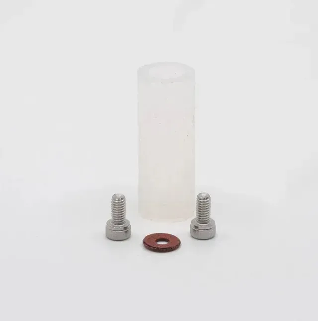 Small white plastic cylinder with two silver bolts and a red washer on a white background