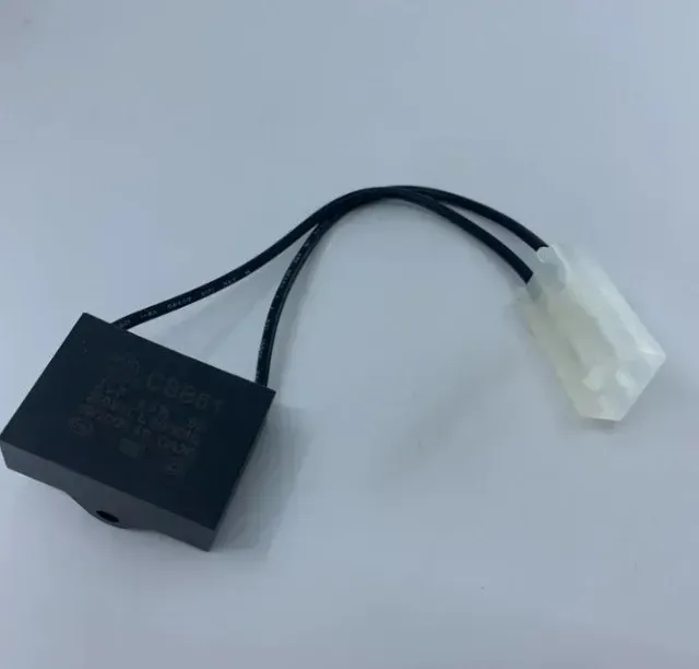 Black electronic relay/module with two wires ending in a white connector on a light background
