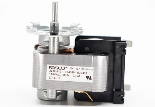 Small silver and black electric motor with a metal shaft and label attached