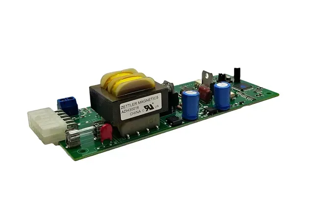 Electronic circuit board with transformer, capacitors, and connectors on a white background